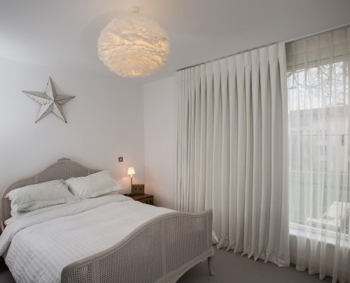 White inverted pleat blackout curtain